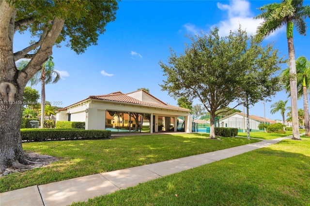 view of front of home with a front lawn