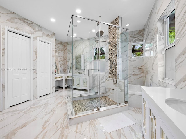 bathroom featuring vanity and plus walk in shower