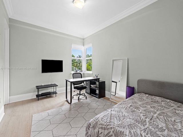 bedroom with crown molding and light wood-type flooring