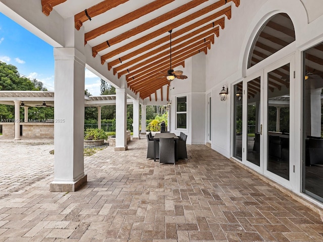 view of patio with ceiling fan and a pergola