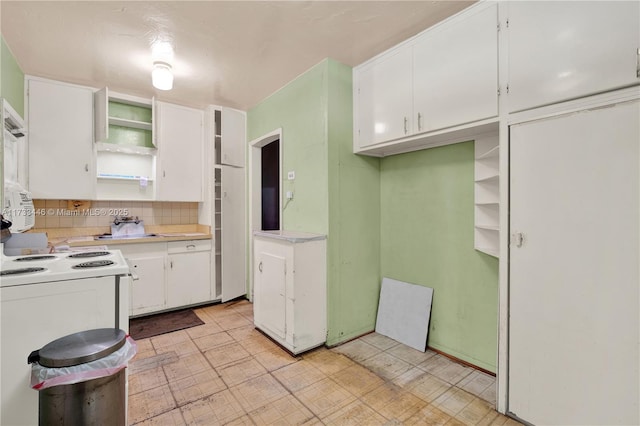 kitchen featuring white cabinetry, decorative backsplash, and white electric range oven