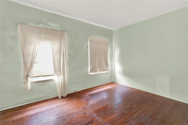 empty room with hardwood / wood-style floors