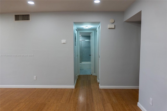 corridor featuring hardwood / wood-style flooring