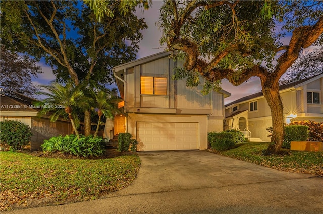 view of front facade with a garage and concrete driveway