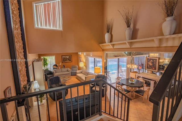 36 Eastmont Rd, Hollywood, FL 33021 - living room featuring tile patterned flooring, a towering ceiling, and a chandelier