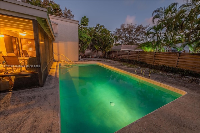 view of pool with a fenced in pool, fence, and a patio