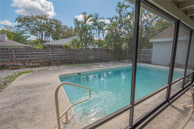 view of swimming pool with a patio area, a fenced backyard, and a fenced in pool