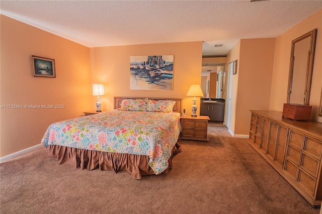 carpeted bedroom featuring a textured ceiling and baseboards