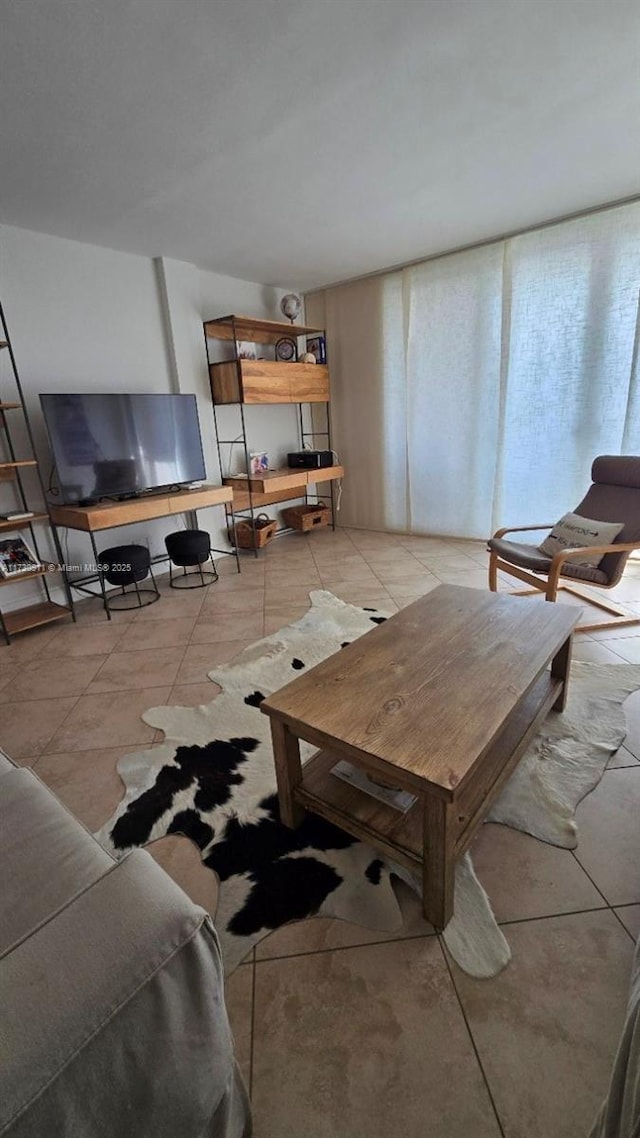 living room with light tile patterned flooring