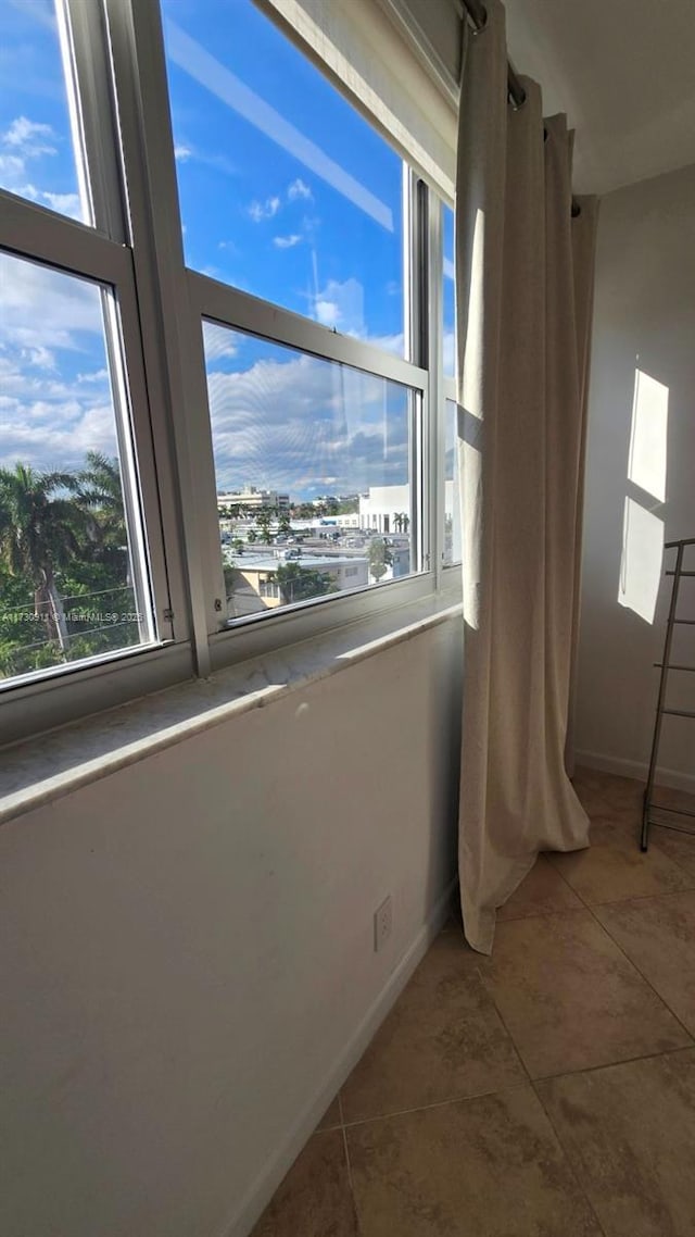 interior space with tile patterned flooring and plenty of natural light