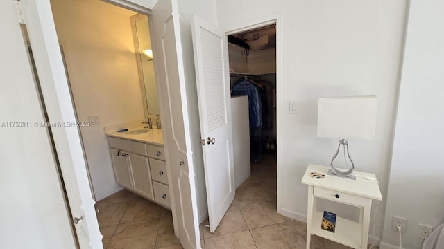 bathroom with tile patterned flooring and vanity