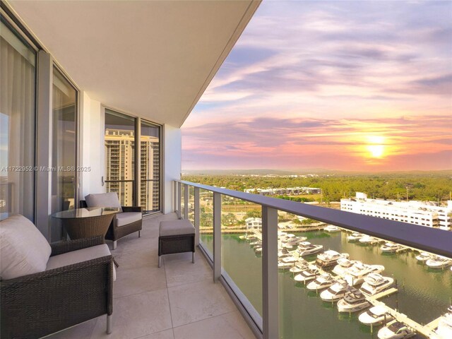 17111 Biscayne Blvd Unit 1705, North Miami Beach, FL 33160 - balcony at dusk with a water view and view of marina