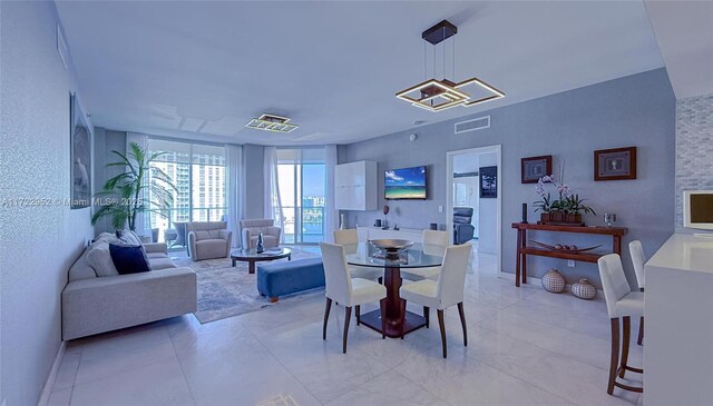 17111 Biscayne Blvd Unit 1705, North Miami Beach, FL 33160 - dining space featuring a textured wall and baseboards