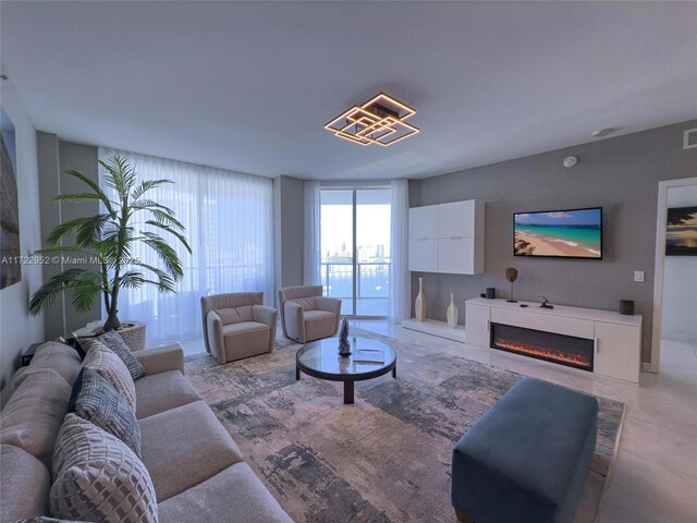 17111 Biscayne Blvd Unit 1705, North Miami Beach, FL 33160 - living room with a glass covered fireplace