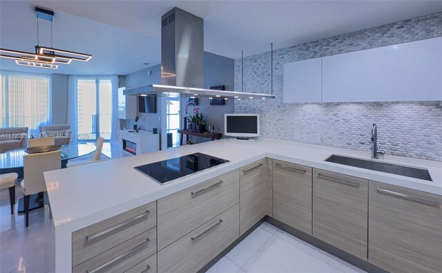 17111 Biscayne Blvd Unit 1705, North Miami Beach, FL 33160 - kitchen with black electric cooktop, a sink, gray cabinets, open floor plan, and island range hood