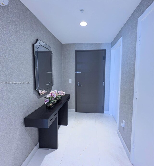 17111 Biscayne Blvd Unit 1705, North Miami Beach, FL 33160 - hallway with recessed lighting and light tile patterned flooring