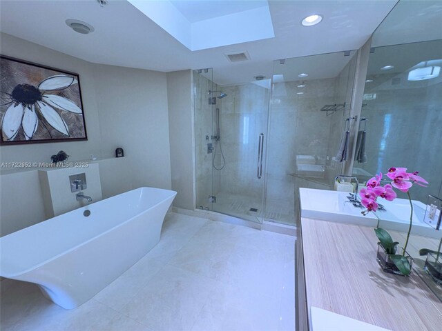 17111 Biscayne Blvd Unit 1705, North Miami Beach, FL 33160 - full bath with a stall shower, a freestanding bath, vanity, and recessed lighting