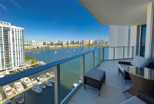 balcony featuring a water view