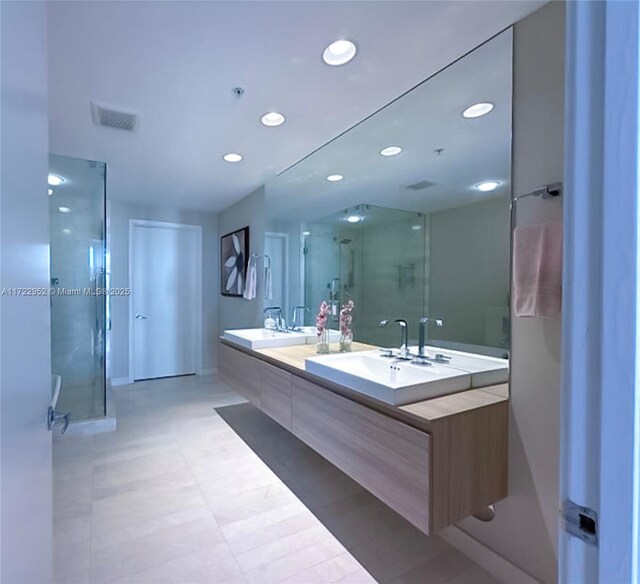 17111 Biscayne Blvd Unit 1705, North Miami Beach, FL 33160 - bathroom with double vanity, a stall shower, and recessed lighting
