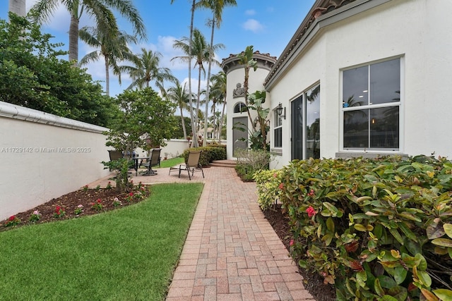 view of yard with a patio and fence