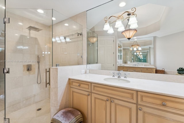 full bath with a stall shower, recessed lighting, and vanity