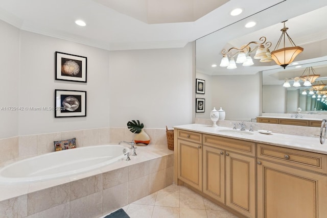 bathroom featuring crown molding, vanity, a bath, and tile patterned floors