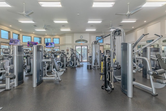 gym featuring visible vents and a ceiling fan