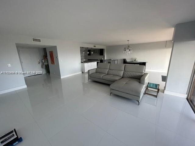 living room featuring a chandelier