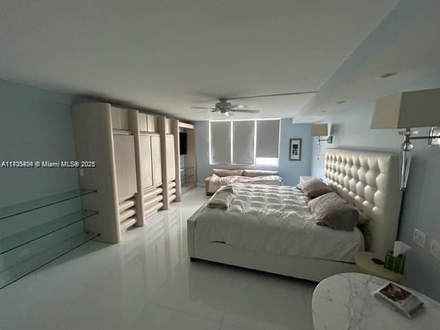 bedroom with light tile patterned floors and ceiling fan