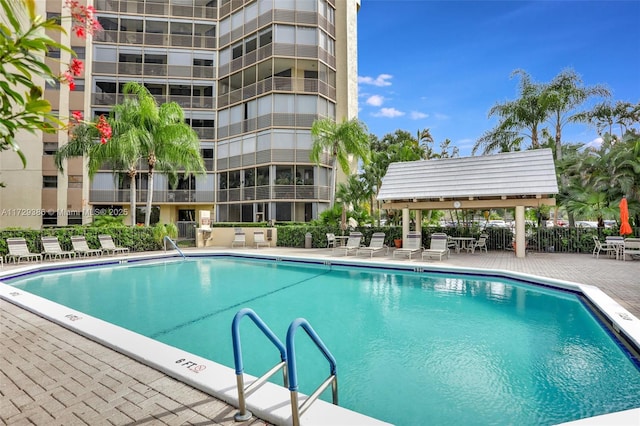 view of swimming pool with a patio