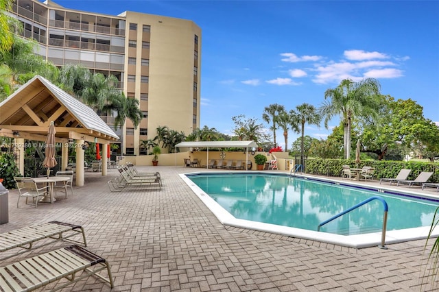 view of swimming pool featuring a gazebo and a patio