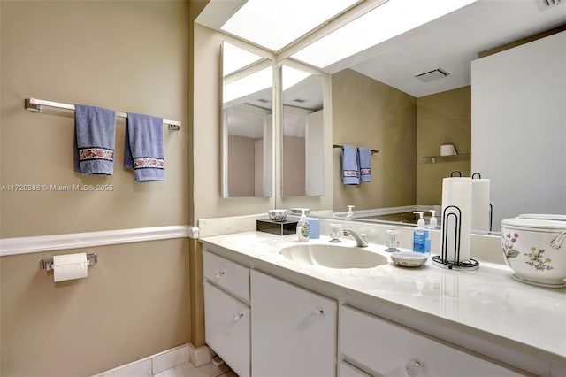 bathroom with vanity and tile patterned flooring