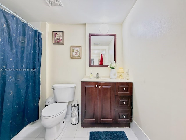 bathroom with tile patterned flooring, vanity, a shower with curtain, and toilet