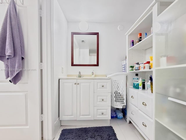 bathroom featuring tile patterned flooring and vanity