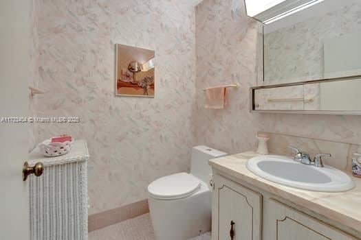 bathroom with vanity and toilet