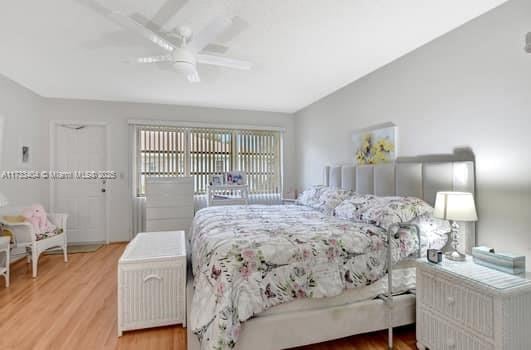 bedroom featuring ceiling fan and wood-type flooring