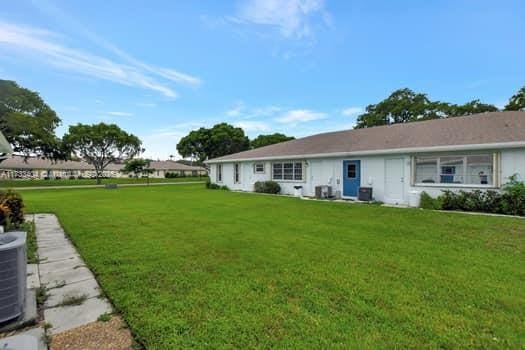 view of yard featuring central AC