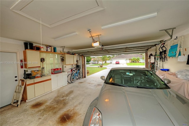 garage featuring a garage door opener