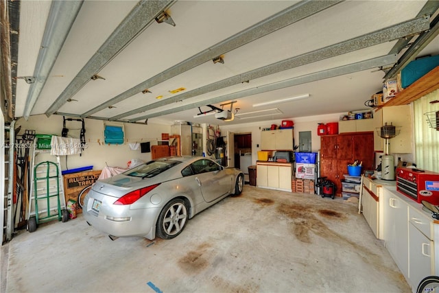 garage featuring a garage door opener and electric panel