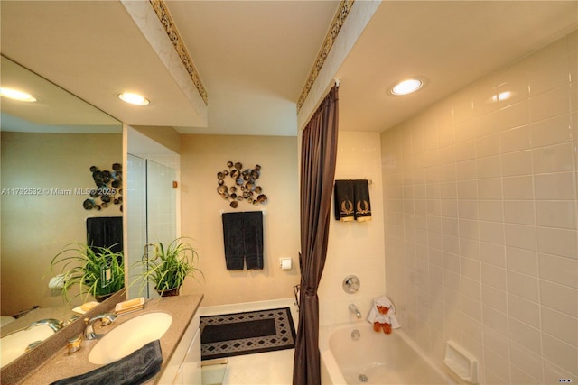 bathroom featuring vanity and shower / tub combo