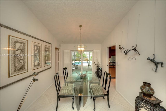 tiled dining room with lofted ceiling, a textured ceiling, and a chandelier