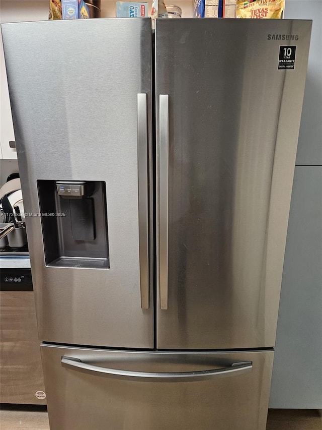 details with stainless steel fridge with ice dispenser