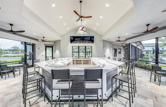 kitchen with a healthy amount of sunlight, open floor plan, and a spacious island