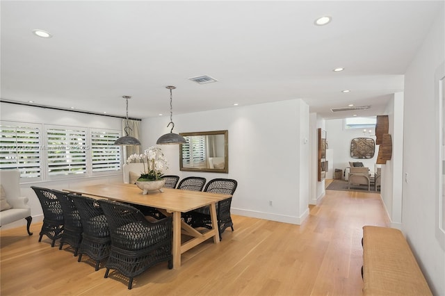 dining area with light hardwood / wood-style flooring