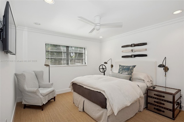 carpeted bedroom featuring ornamental molding and ceiling fan