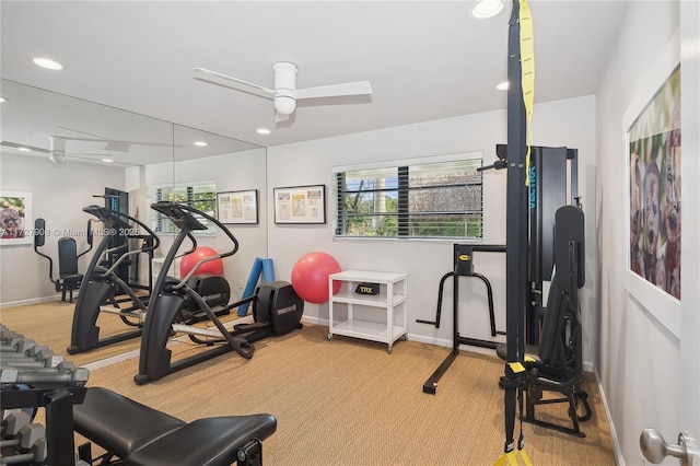 exercise room featuring ceiling fan and light carpet