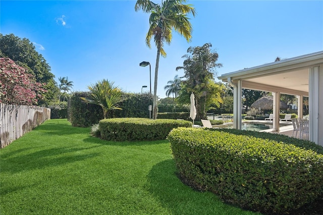 view of yard with a fenced in pool