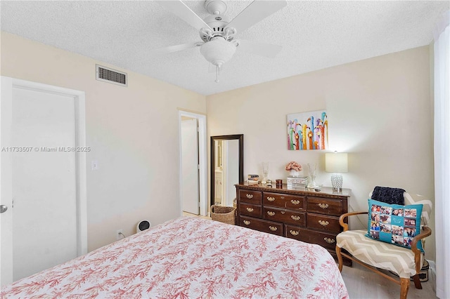 2751 E Golf Blvd Unit 2029, Pompano Beach, FL 33064 - bedroom featuring wood finished floors, a textured ceiling, and a ceiling fan