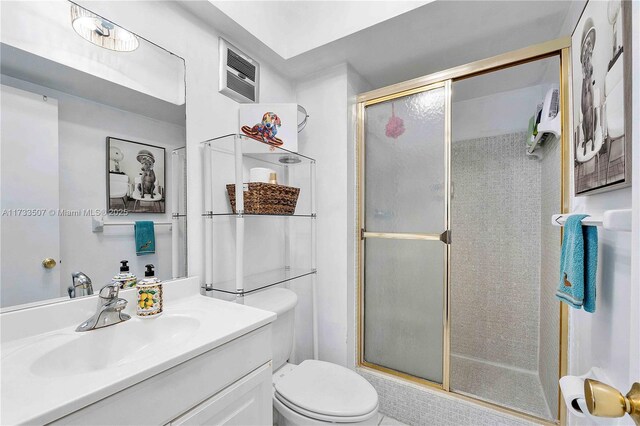 2751 E Golf Blvd Unit 2029, Pompano Beach, FL 33064 - bathroom featuring a shower stall, toilet, and vanity