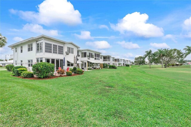 2751 E Golf Blvd Unit 2029, Pompano Beach, FL 33064 - rear view of property with a lawn